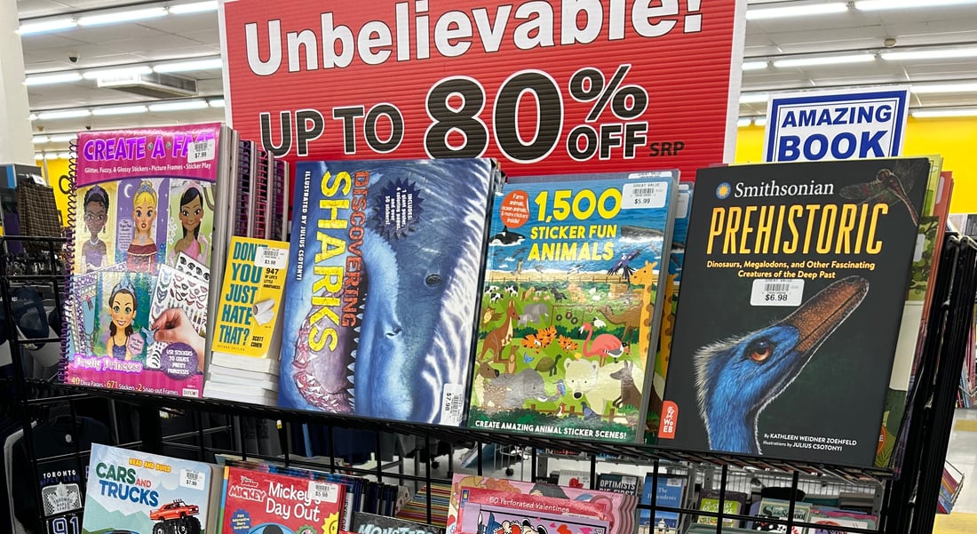 Unbelievable! Up to 80% off value signage above a stocked wire rack